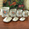Ensemble de 4 pots à épices en faïence fine et décor fleurs multicolores Circa 1930 par Hello Broc brocante en ligne
