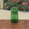 Petit bocal publicitaire Ariel en verre moulé vert années 60 par Hello Broc brocante en ligne