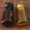 Lot de 2 bocaux style pot apothicaire en verre moulé ambré : 1 marron et 1 jaune par Hello Broc brocante en ligne