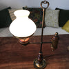 Lampe de bureau dans le style quinquet en laiton et bois abat-jour opaline blanche années 80 par Hello Broc brocante en ligne