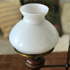 Lampe de bureau dans le style quinquet en laiton et bois abat-jour opaline blanche années 80 par Hello Broc brocante en ligne