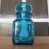 Petit bocal publicitaire pour Ariel en verre moulé bleu par Hello Broc brocante en ligne