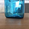 Petit bocal publicitaire pour Ariel en verre moulé bleu par Hello Broc brocante en ligne