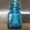 Petit bocal publicitaire pour Ariel en verre moulé bleu par Hello Broc brocante en ligne